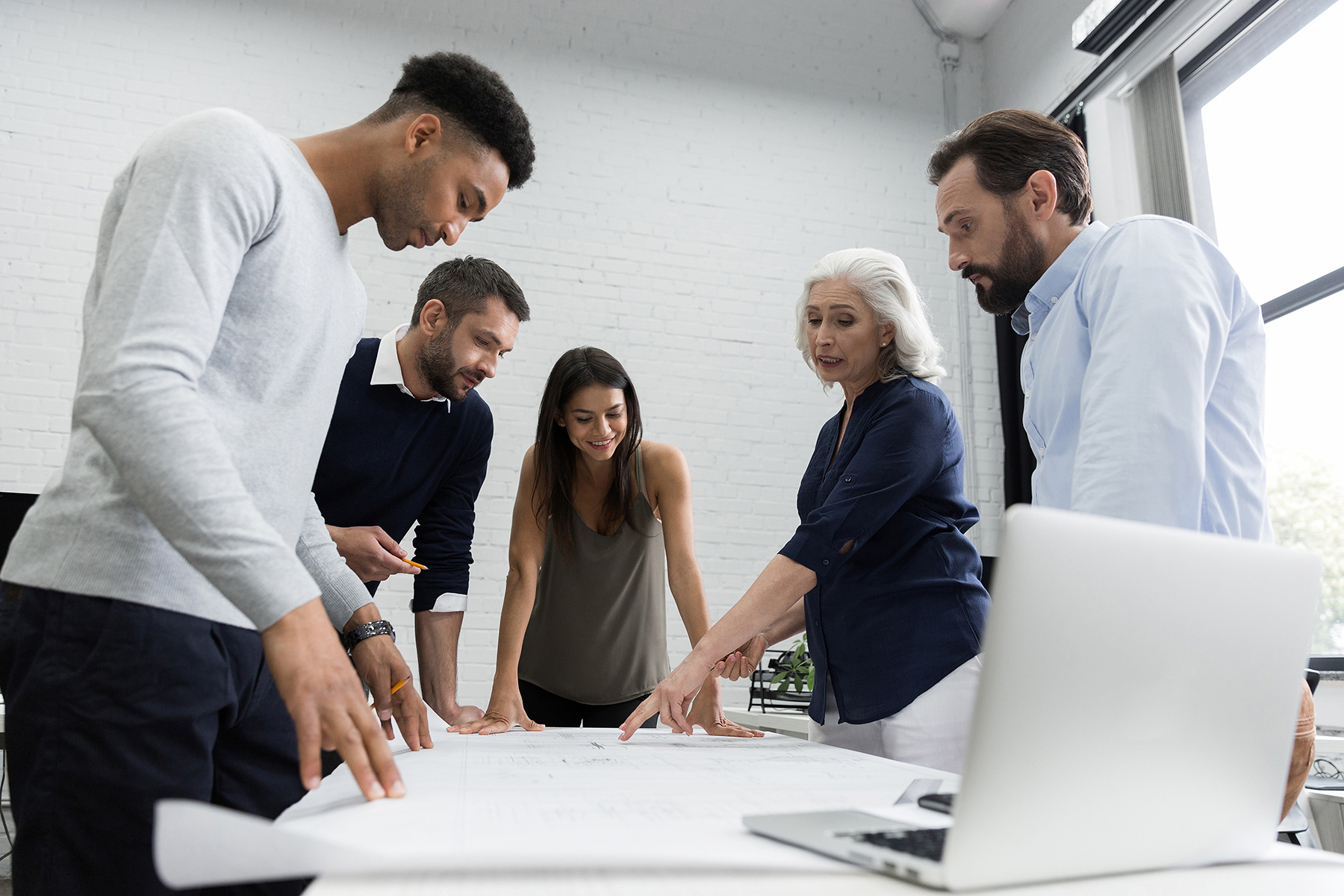 Group of business people discussing financial plan at the table in an office