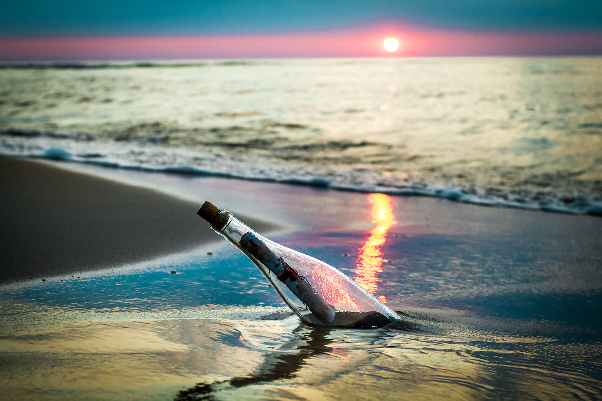 Bottle with a message thrown by the sea