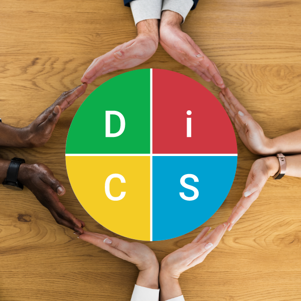 The DiSC Logo set between people's hands. 